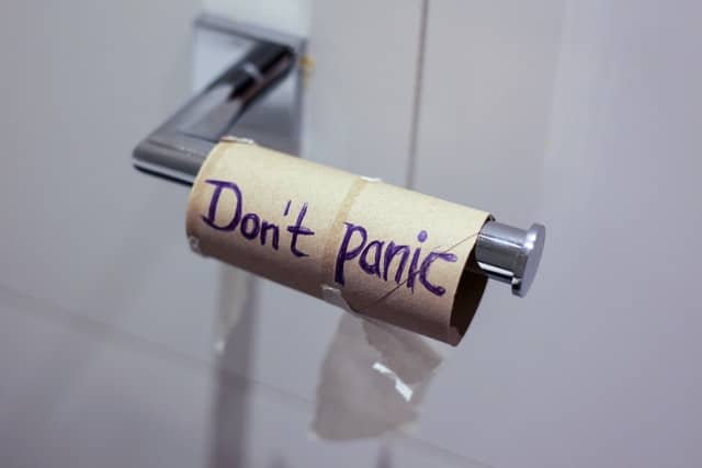 toilet roll that says "don't panic"